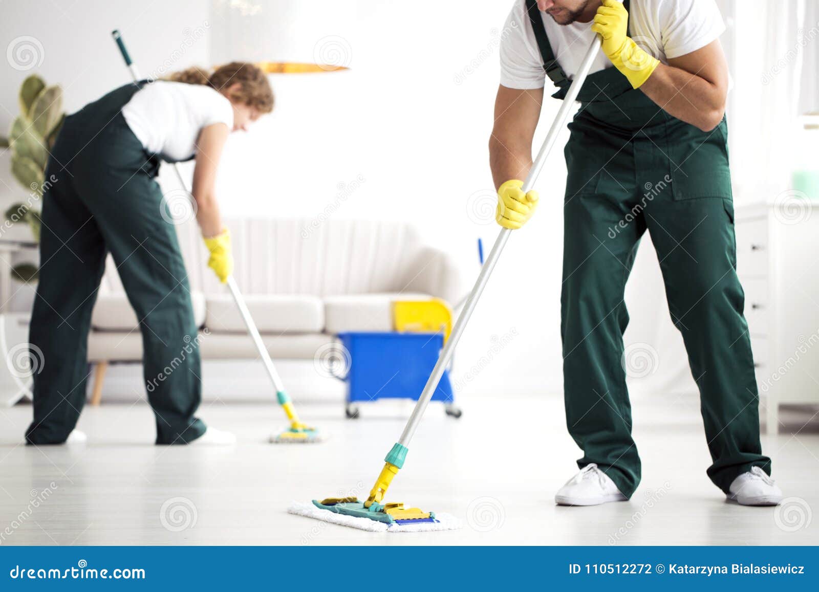 professional cleaning crew washing floor