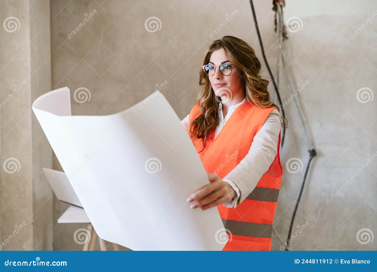 Professional Confident Architect Woman In Construction Site Holding Blueprints Home Renovation