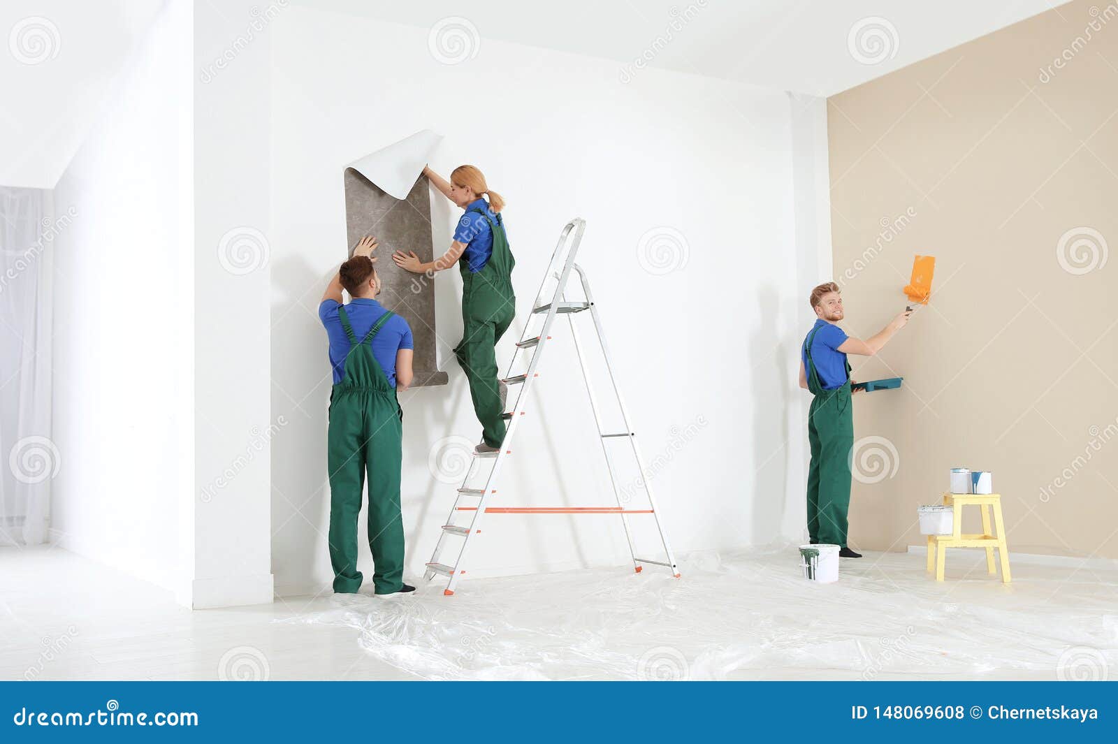 Professional Decorators Working. Home Repair Service Stock Photo