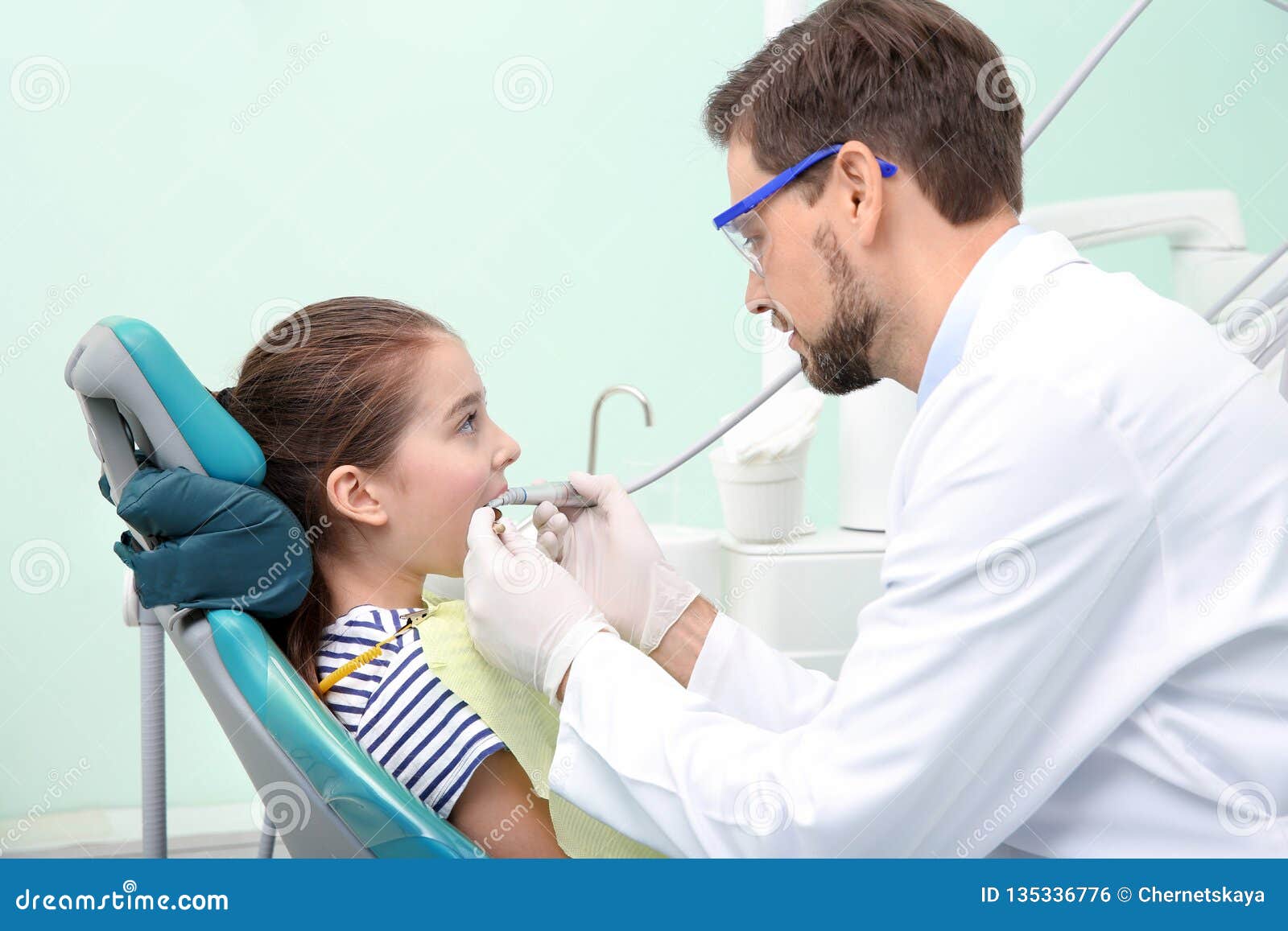 Professional Dentist Working with Little Patient in Clinic Stock Photo