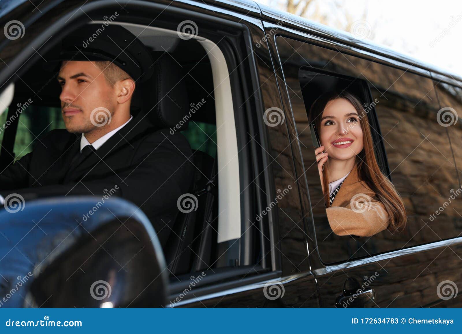 professional driver and businesswoman in car. chauffeur service