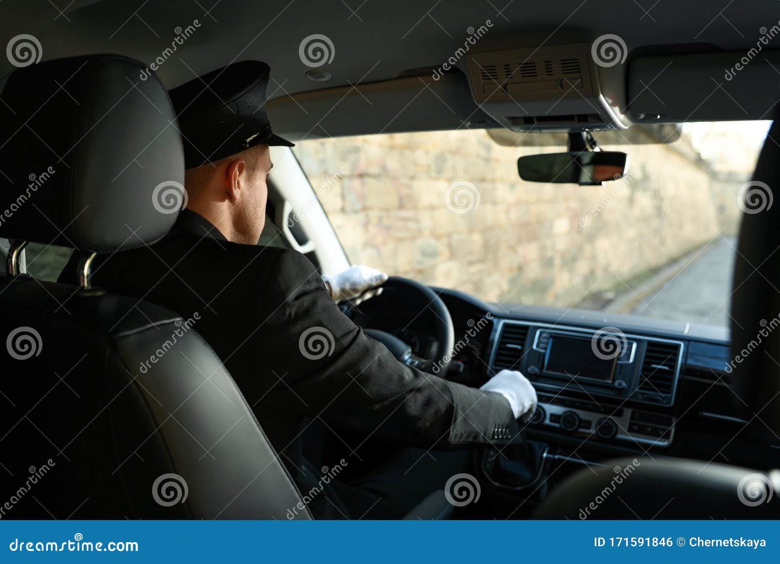 Professional Driver In Car. Chauffeur Service Stock Photo