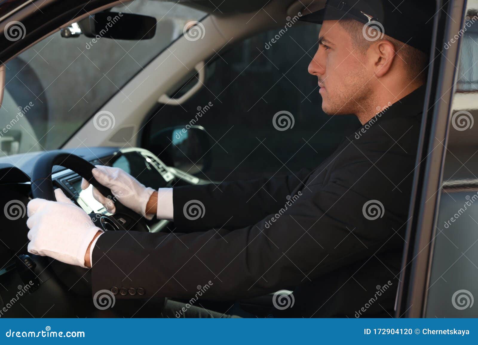 Professional Driver In Car. Chauffeur Service Stock Photo