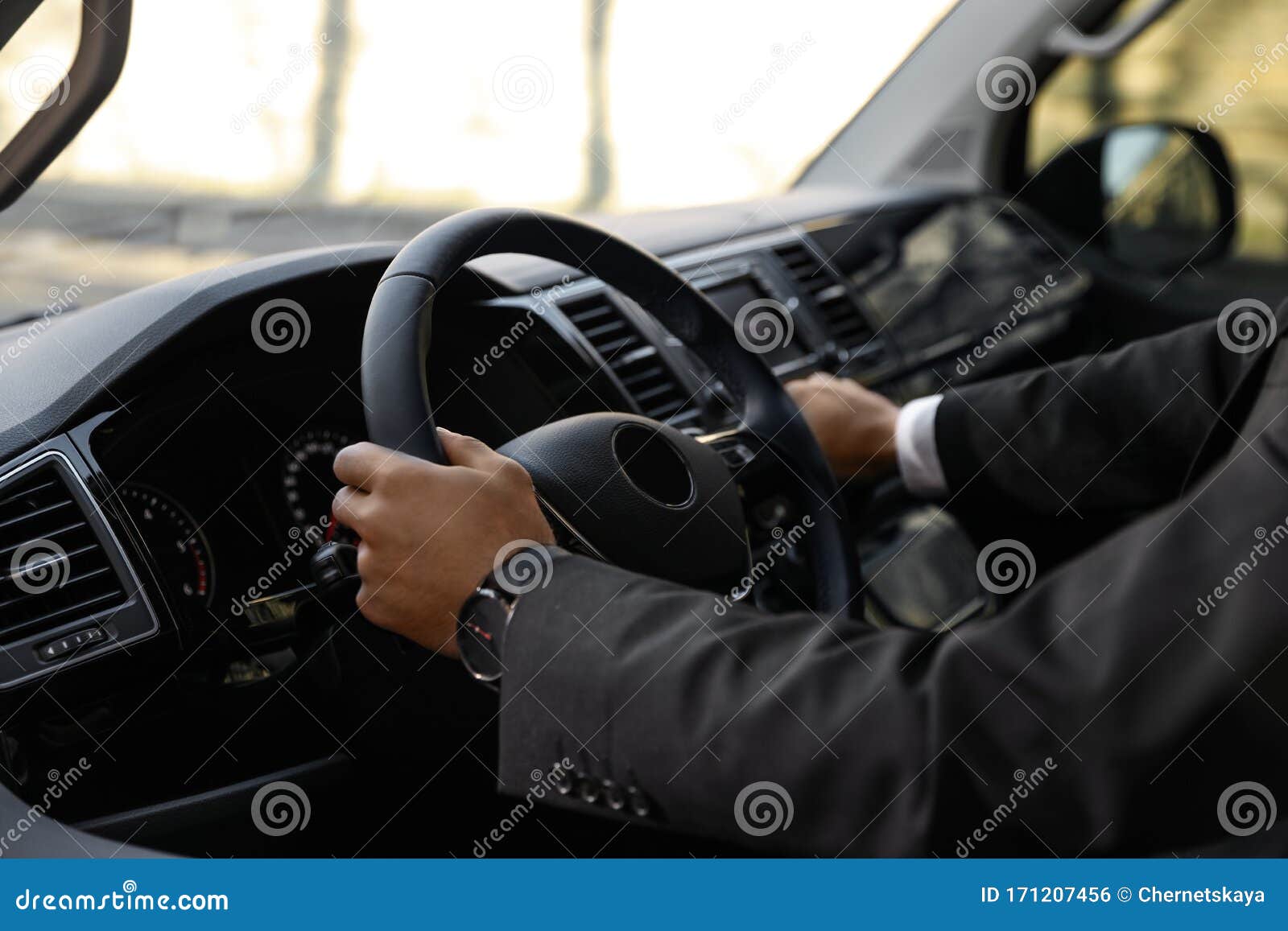 Professional Driver in Luxury Car. Chauffeur Service Stock Photo