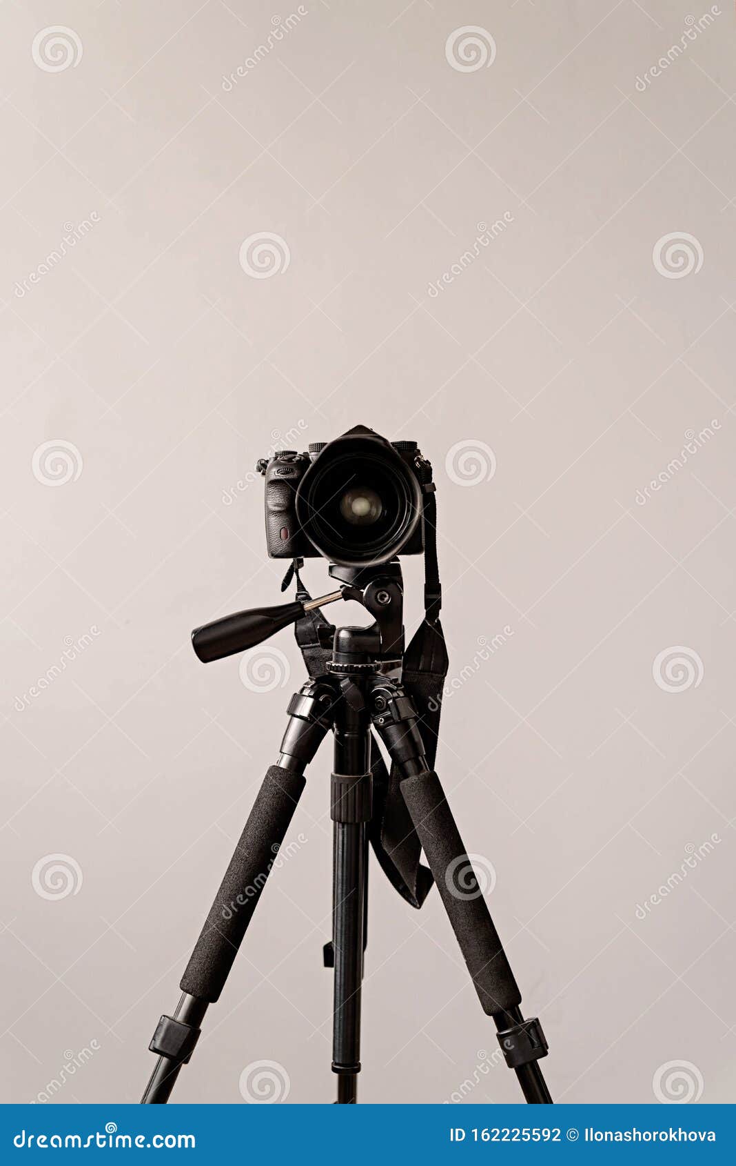 Professional DSLR Camera on a Tripod Isolated on Gray Background with ...