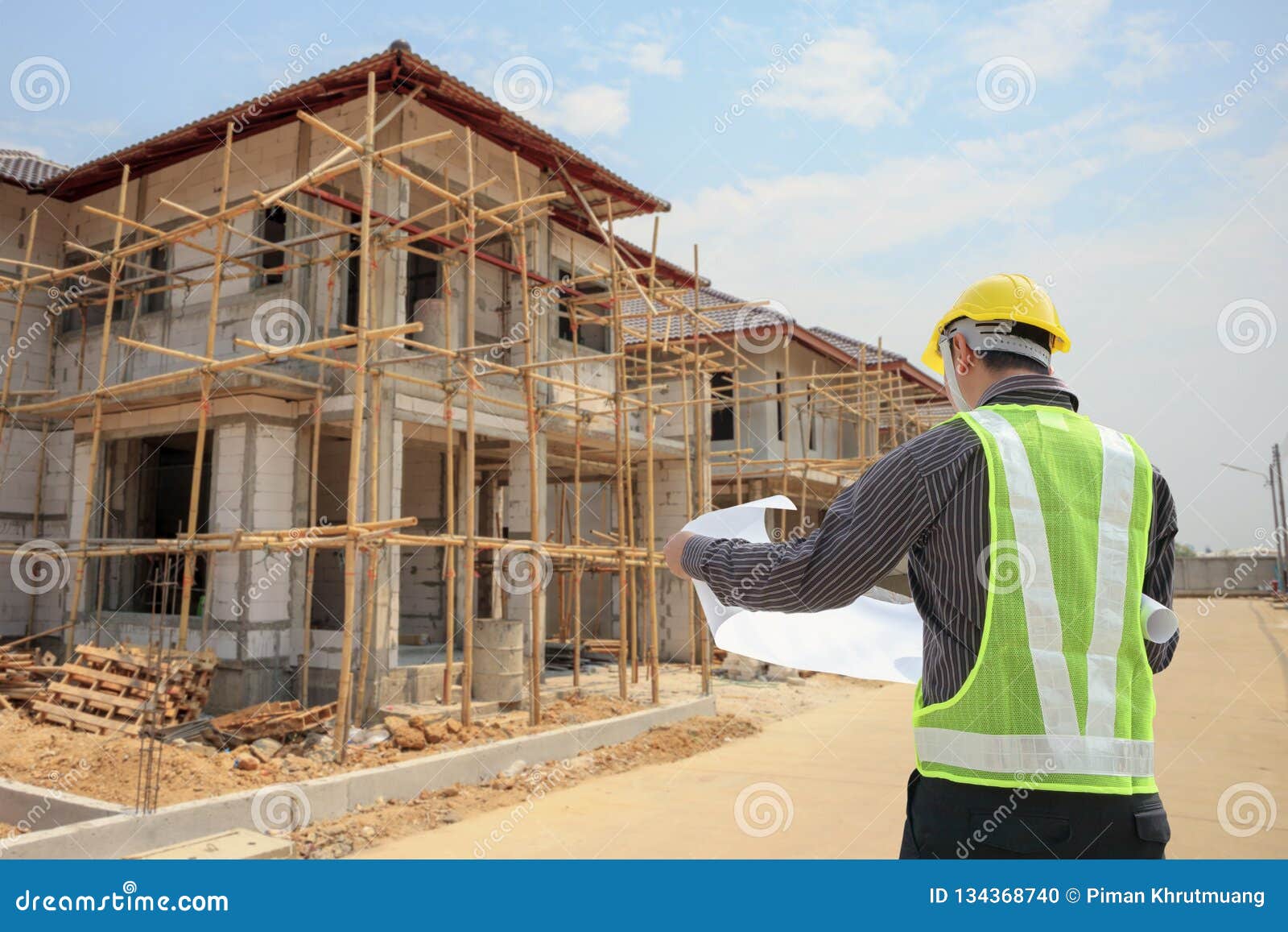 Professional Engineer Architect Worker with Protective Helmet and  Blueprints Paper at House Building Construction Site Stock Photo - Image of  blueprints, architecture: 134368740