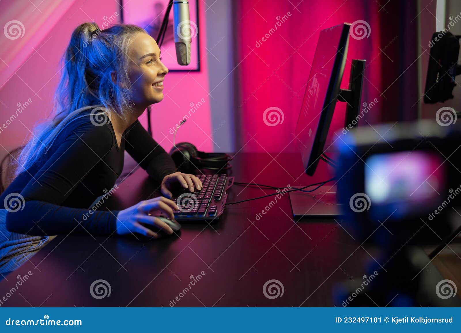 Happy Pretty Blonde Gamer Girl Playing Online Video Game on Her Personal  Computer Stock Photo - Alamy