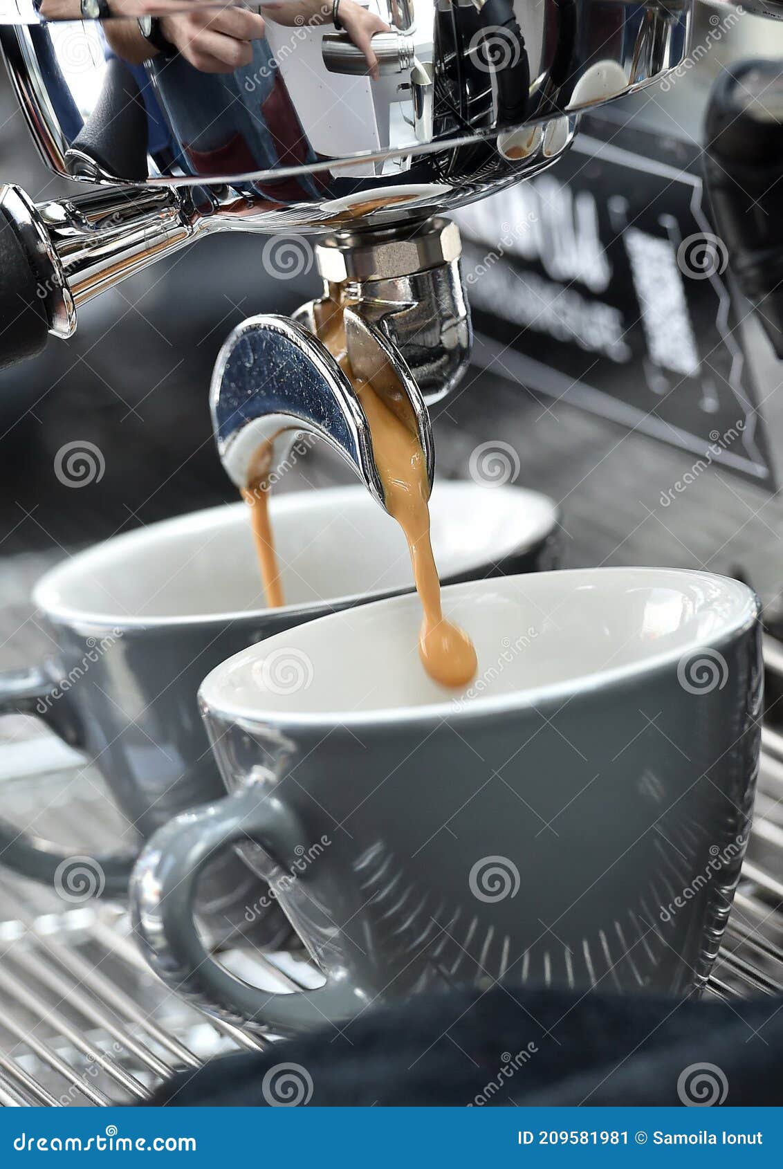 professional espresso machine while preparing two espressos. coffee machine.