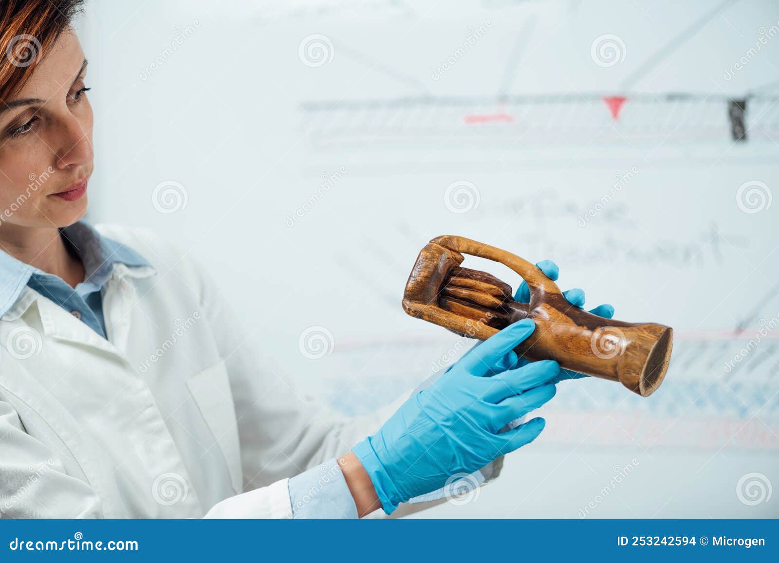 Professional Female Conservator Explaining Wooden Sculpture Restoration