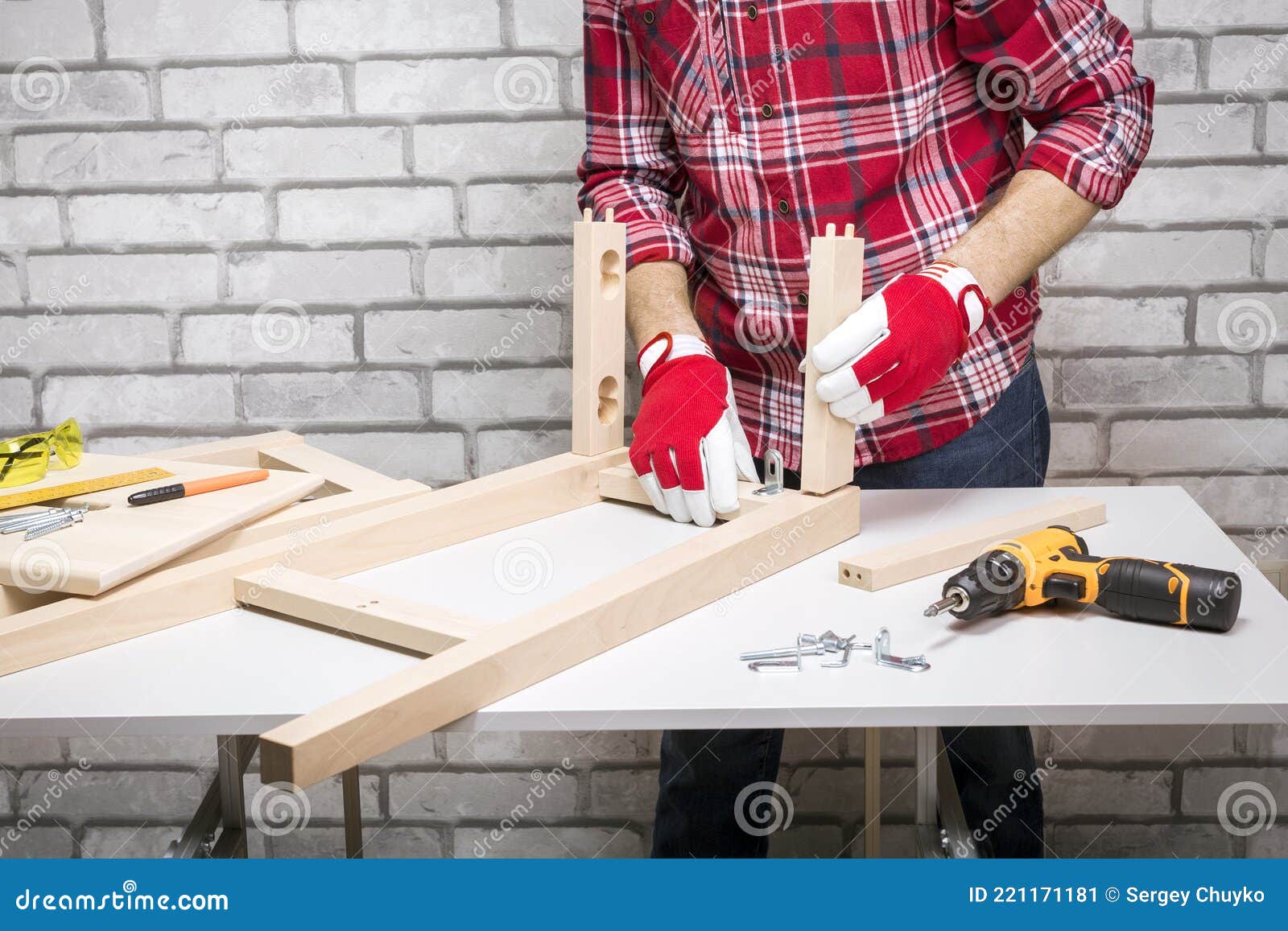 Professional Furniture Assembly Worker Assembles Chair. Stock Image
