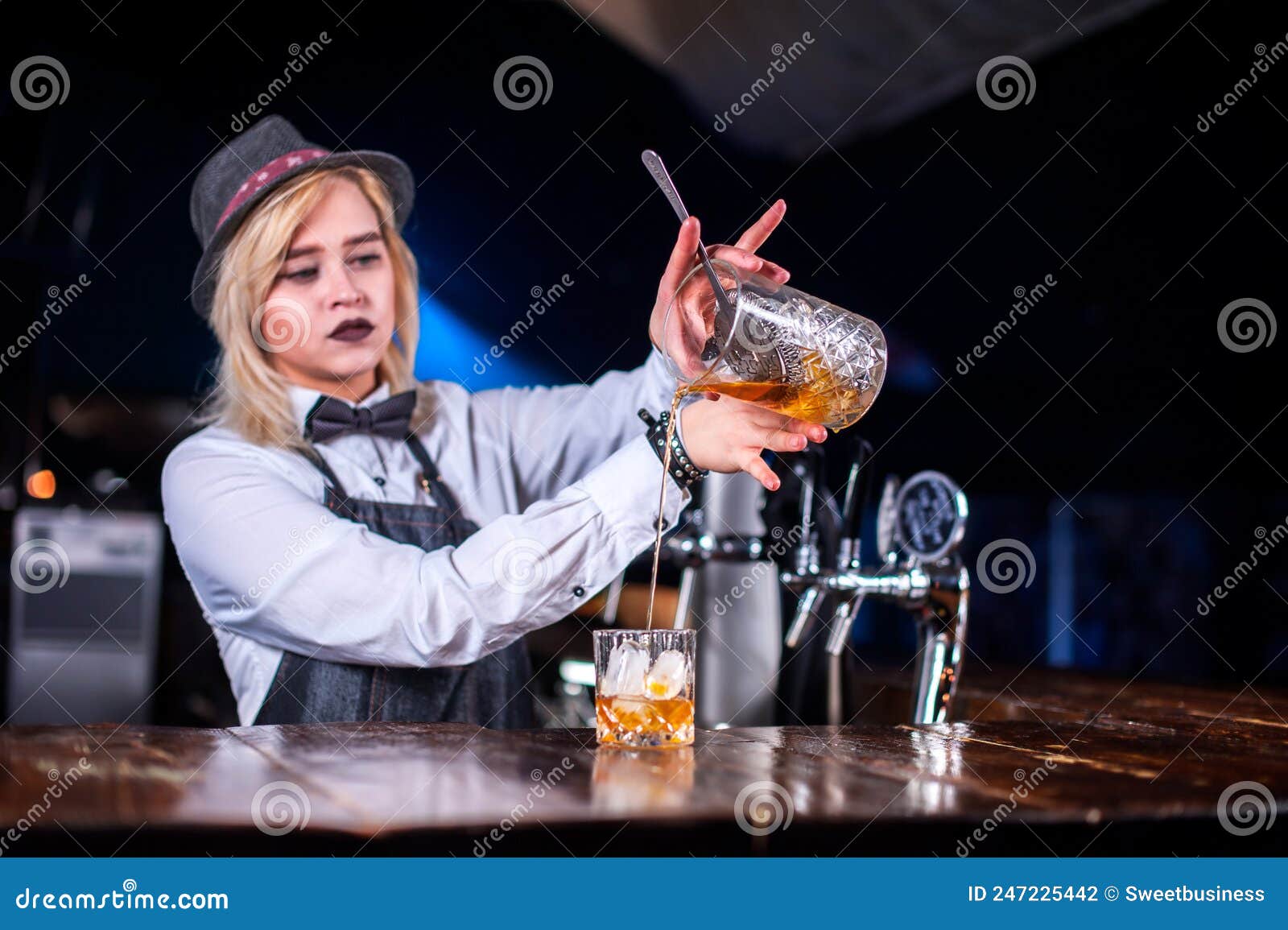 Experienced Woman Bartending Pouring Fresh Alcoholic Drink into the ...