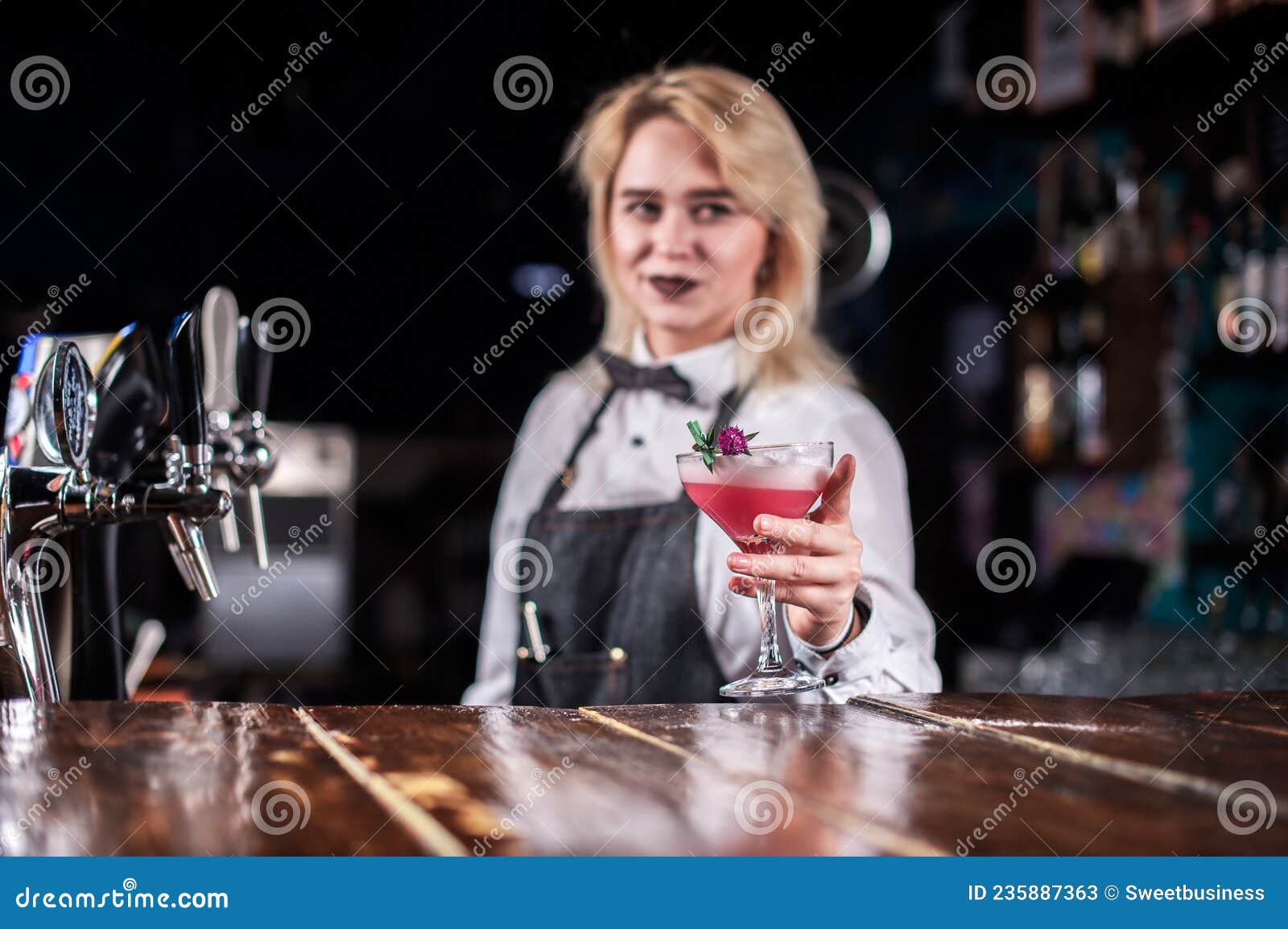 Professional Girl Bartending Places the Finishing Touches on a Drink ...