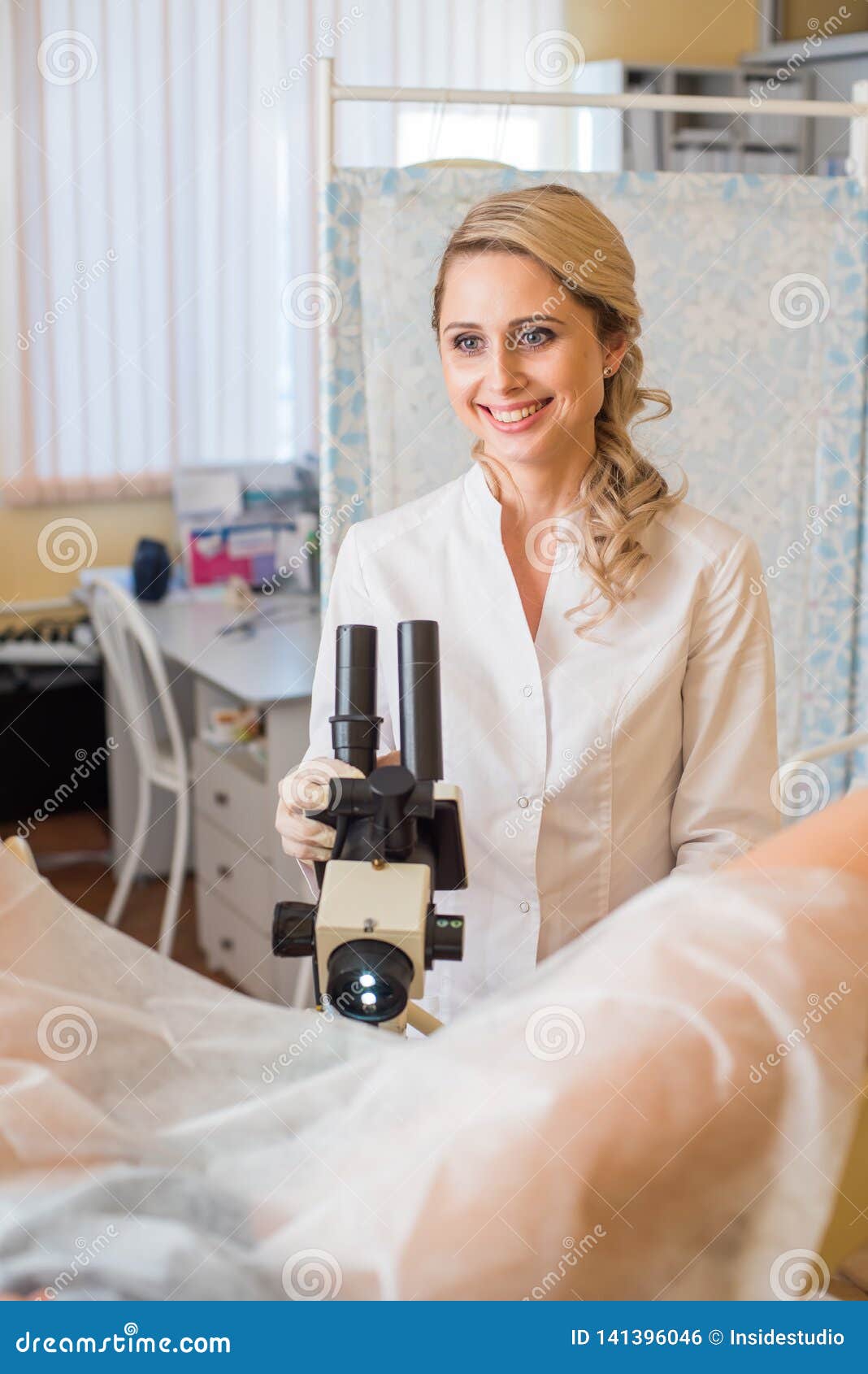 Professional Gynecologist Examining Her Female Patient On A Gynecological Chair Royalty Free 