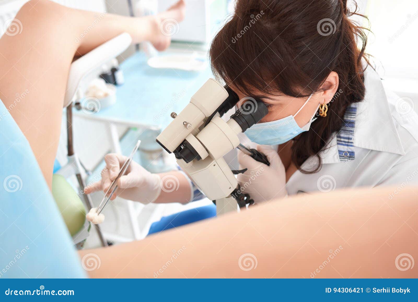 Professional Gynecologist Examining Female Patient On Gynecological
