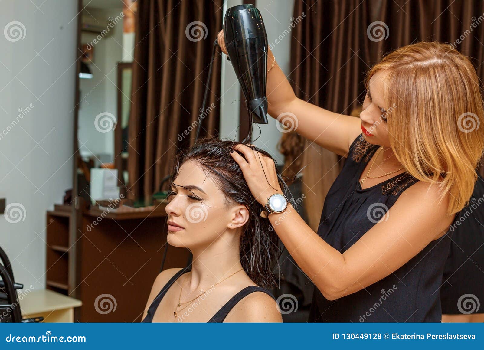 Professional Hairdresser with a Client in the Salon Stock Photo - Image