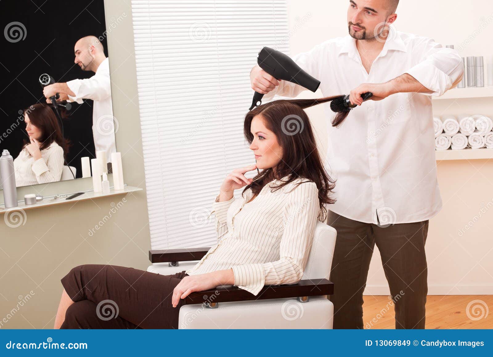 Professional Hairdresser With Hair Dryer At Salon Stock 