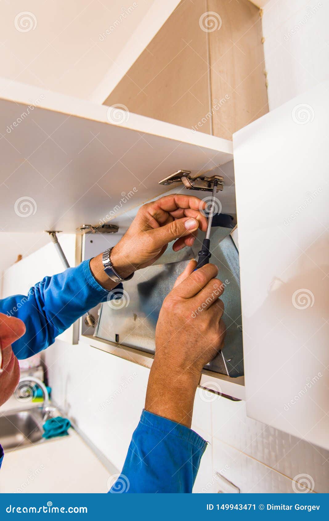 Professional Handyman Fixing the Cupboard Stock Image - Image of installing, furniture: 149943471