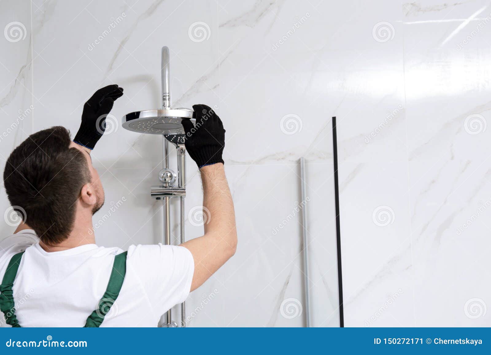 Professional Handyman Working in Shower Booth Indoors Stock Image
