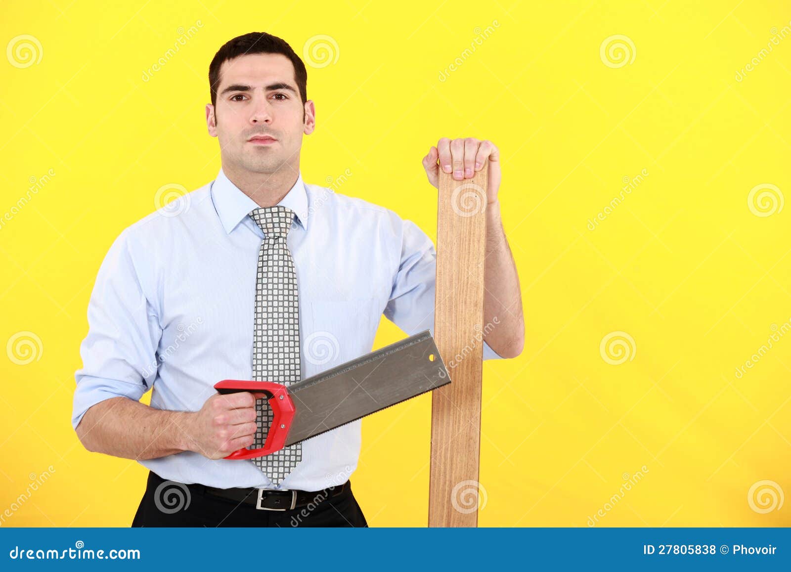 Professional holding a saw and a plank of wood