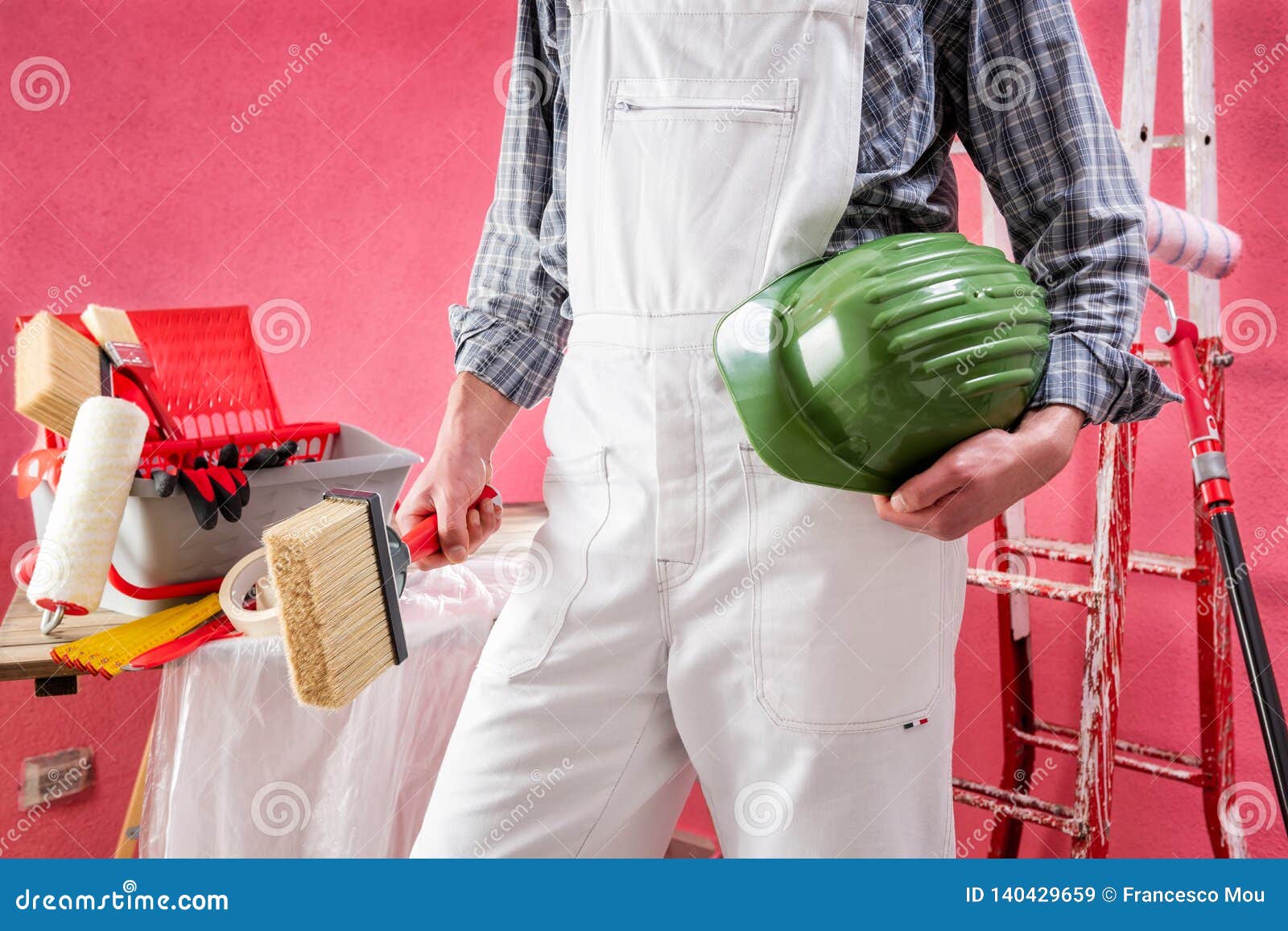 Professional House Painter At Work On The Construction Site Stock Image