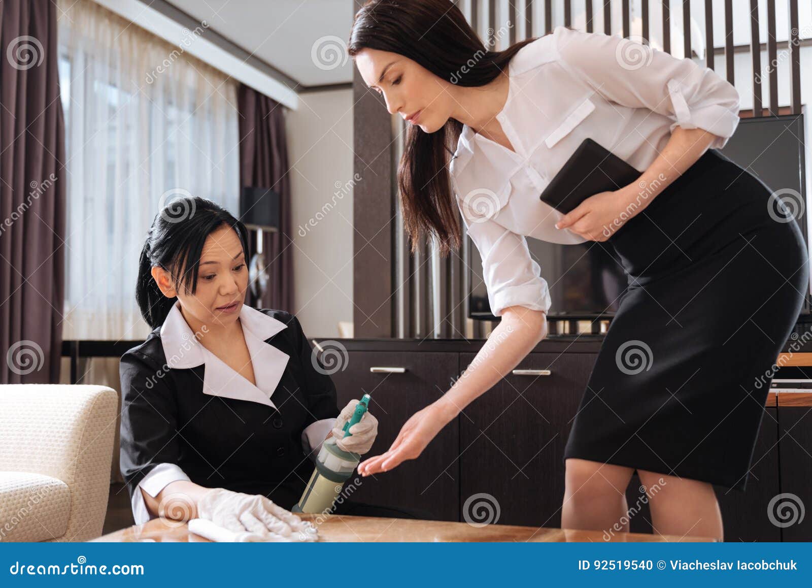 Professional Housekeeping Manager Checking the Work of the Staff Stock
