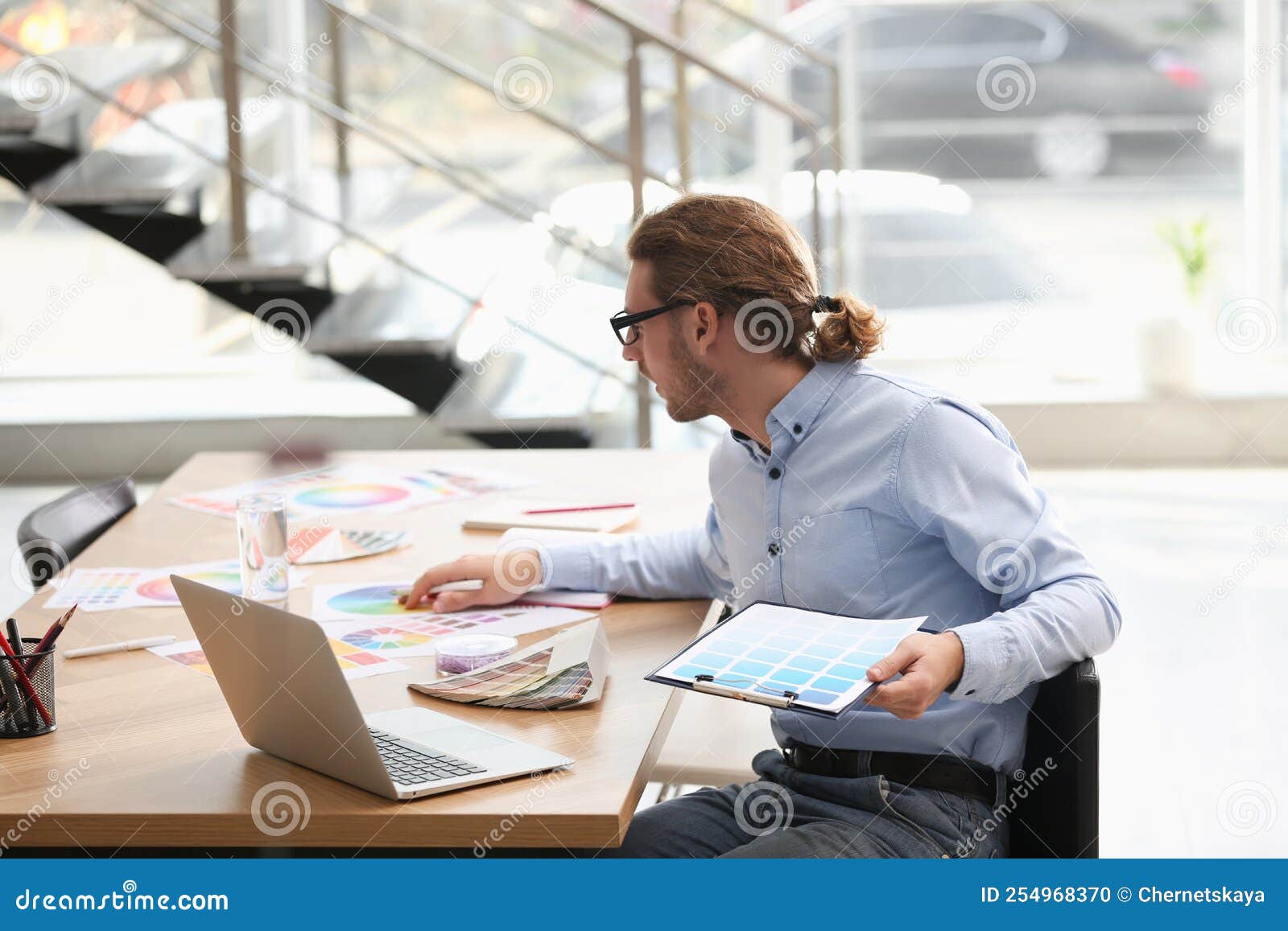Professional Interior Designer at Workplace in Office Stock Photo