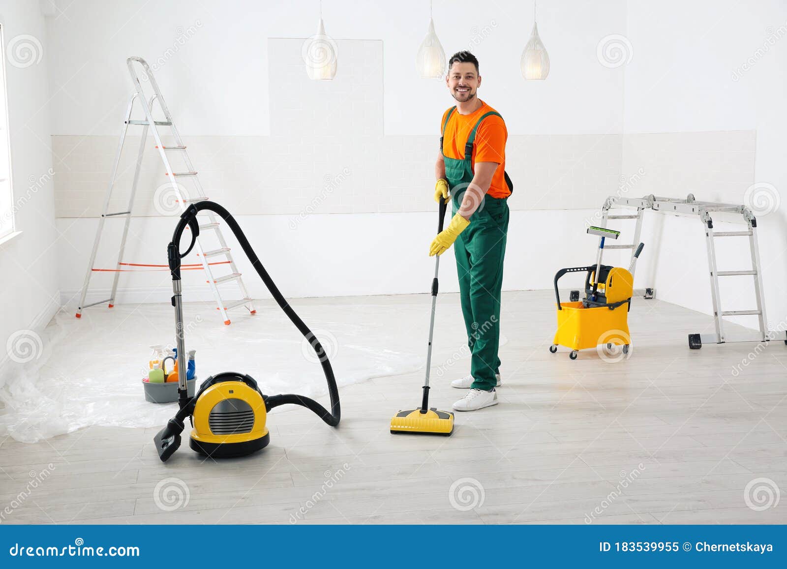 Janitor Cleaning Floor with Mop after Renovation Stock Image Image of