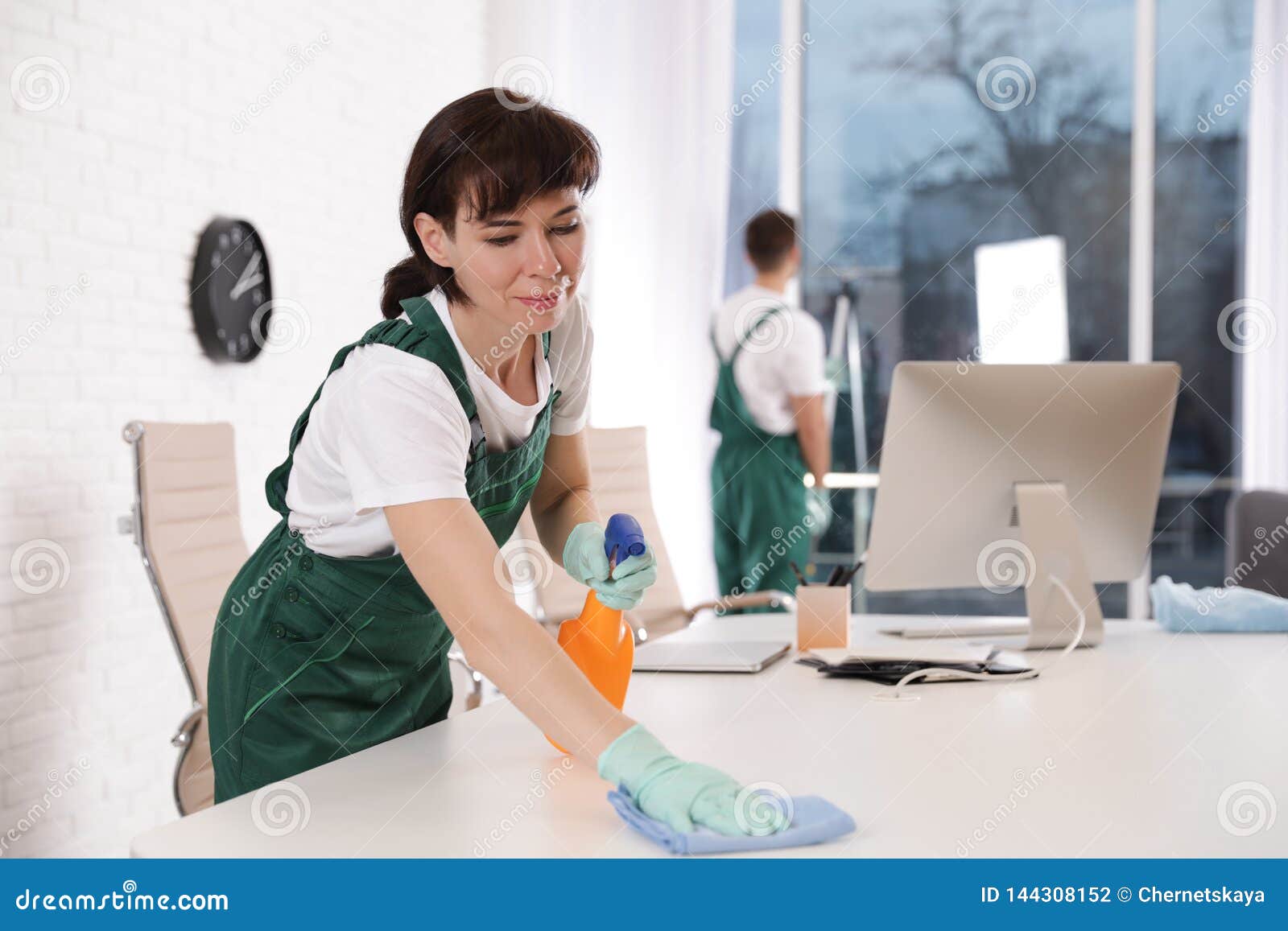 Professional Janitor Cleaning Table in Office Stock Photo Image of