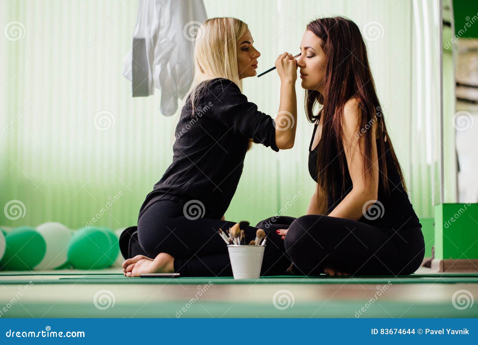 Professional Makeup Artist Working With Beautiful Young Woman