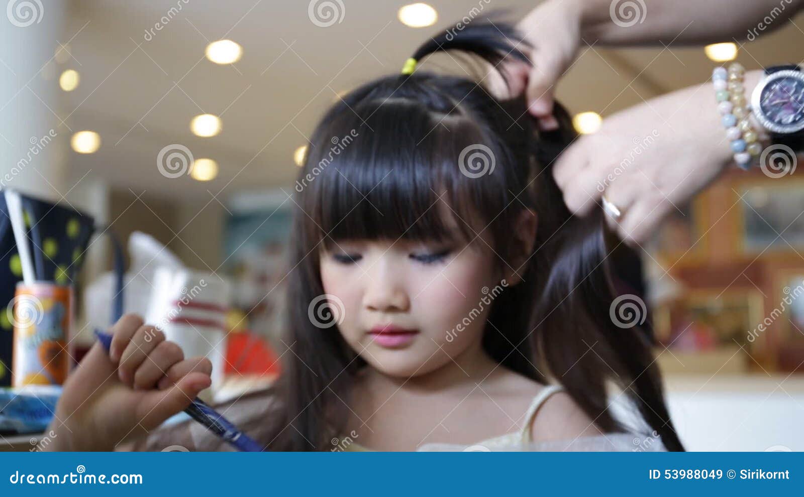 Professional Makeup Artist Working with Cute Asian Child Stock Video