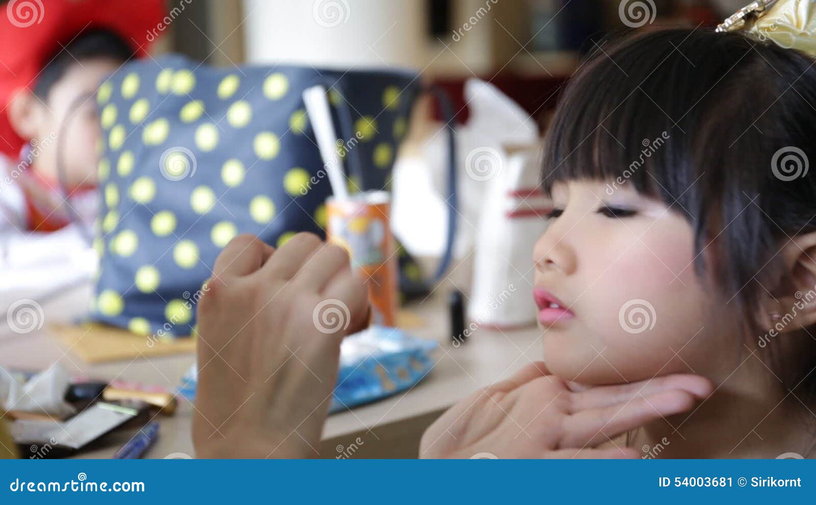 Professional Makeup Artist Working with Cute Asian Child Stock Video