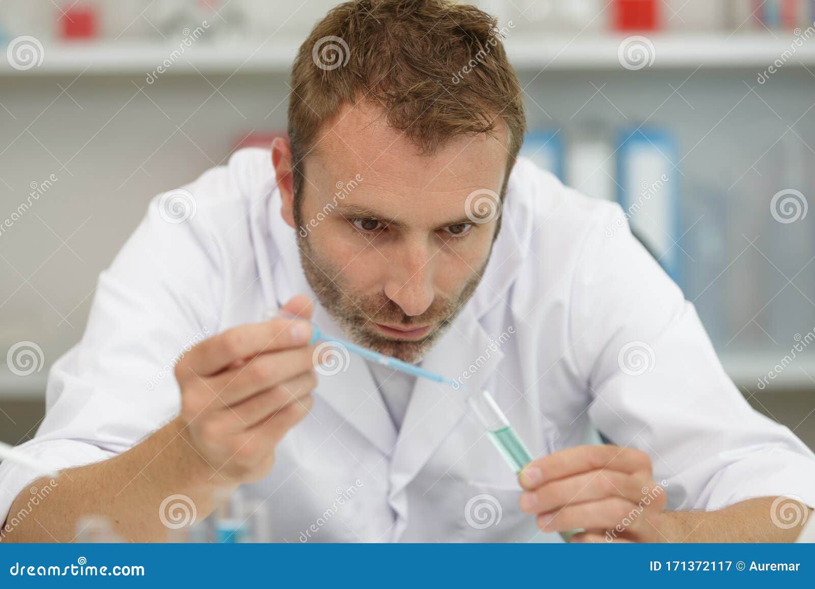 Professional Male Laboratorian Working With Pipette RoyaltyFree Stock