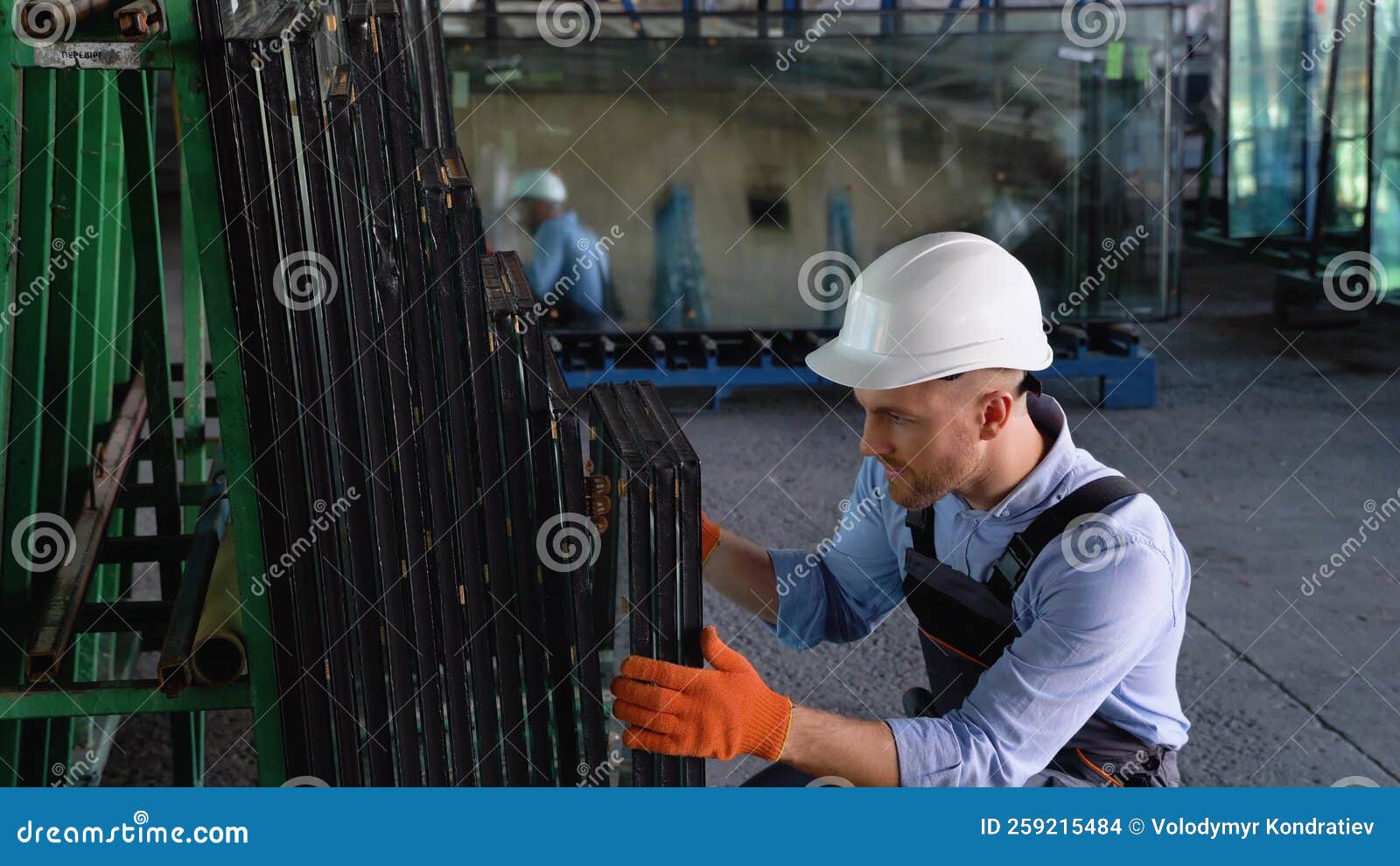 Professional Man Worker in a Window Warehouse Prepares Windows for