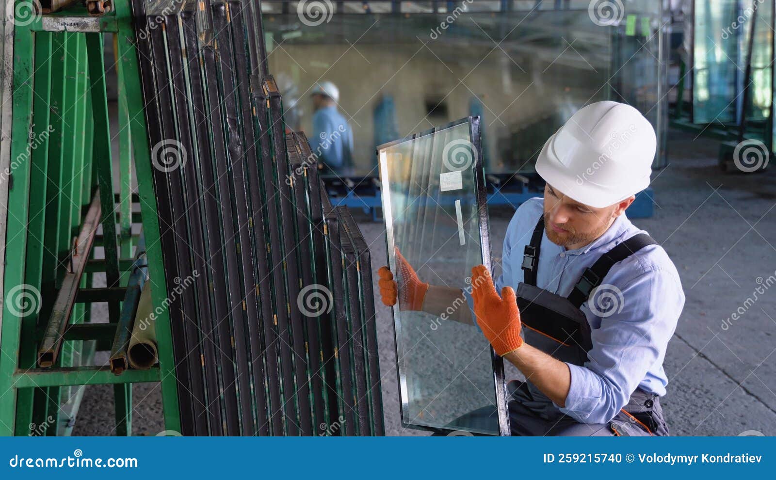 Professional Man Worker in a Window Warehouse Prepares Windows for