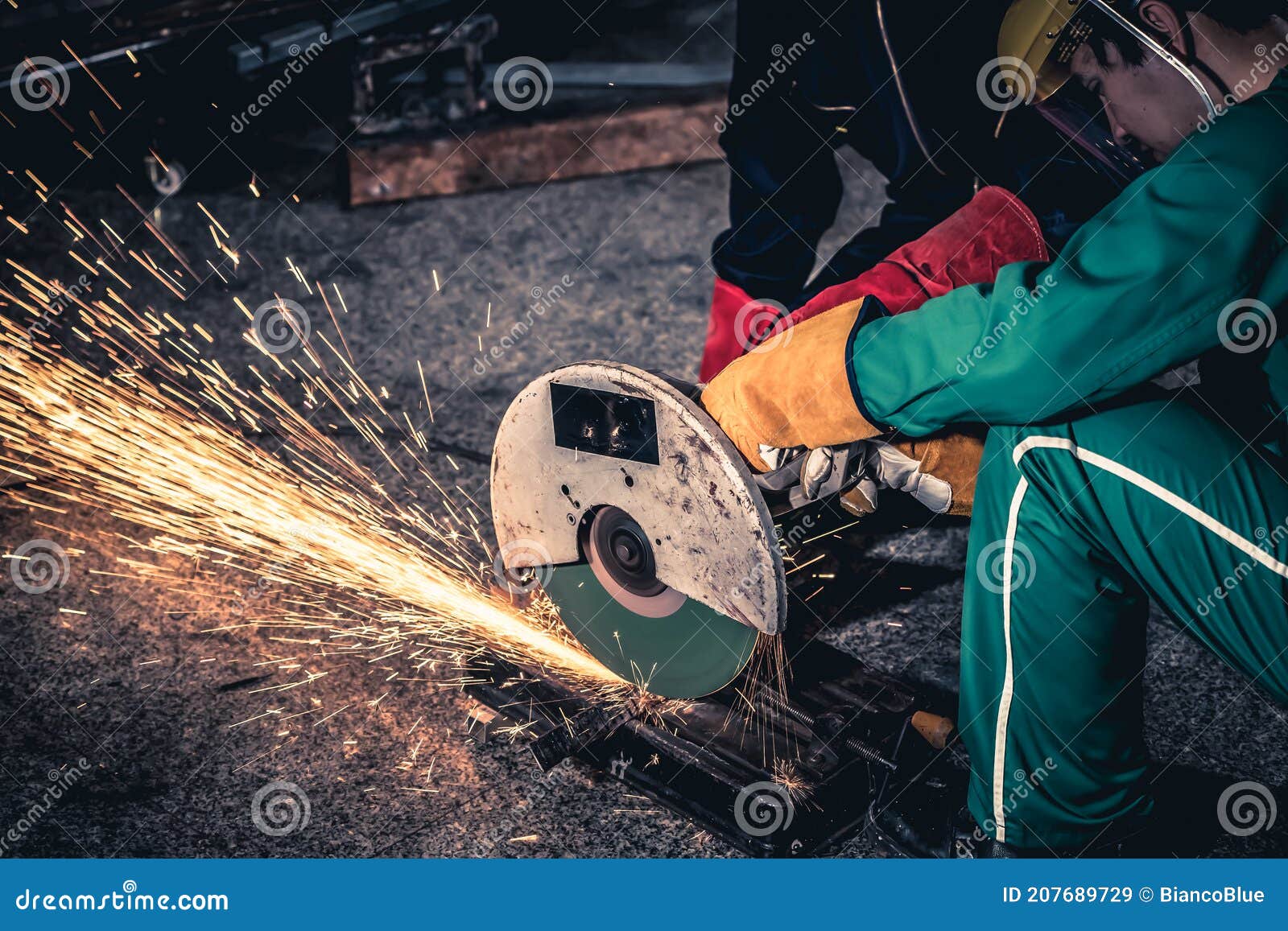 Professional Mechanic Man is Cutting Steel Metal with Rotating Carbon