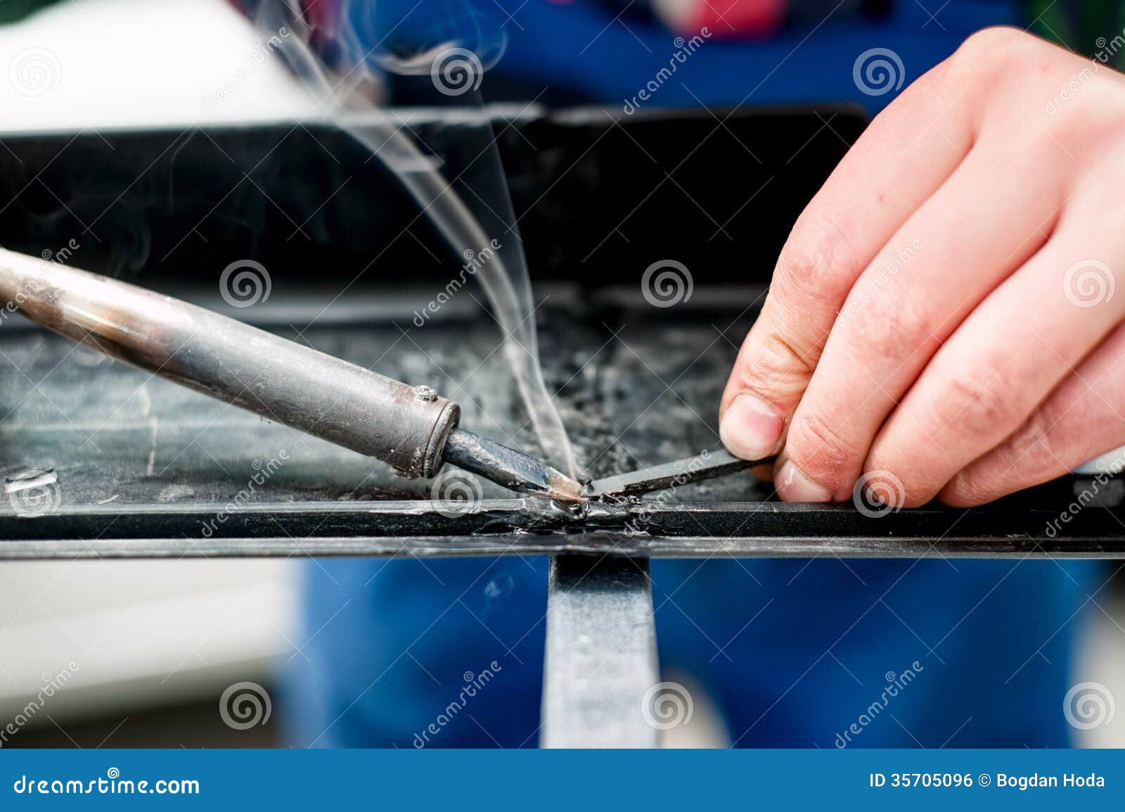 Professional Mechanic Using Plastic Synthetic Welder Stock Photos