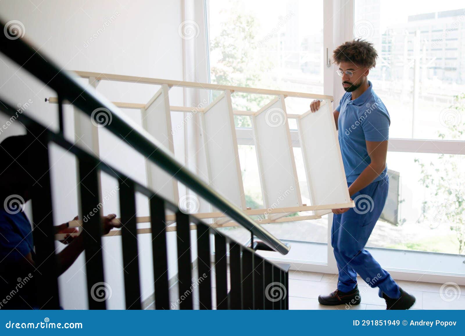 Professional Movers Unloading Furniture Stock Image Image of carrying