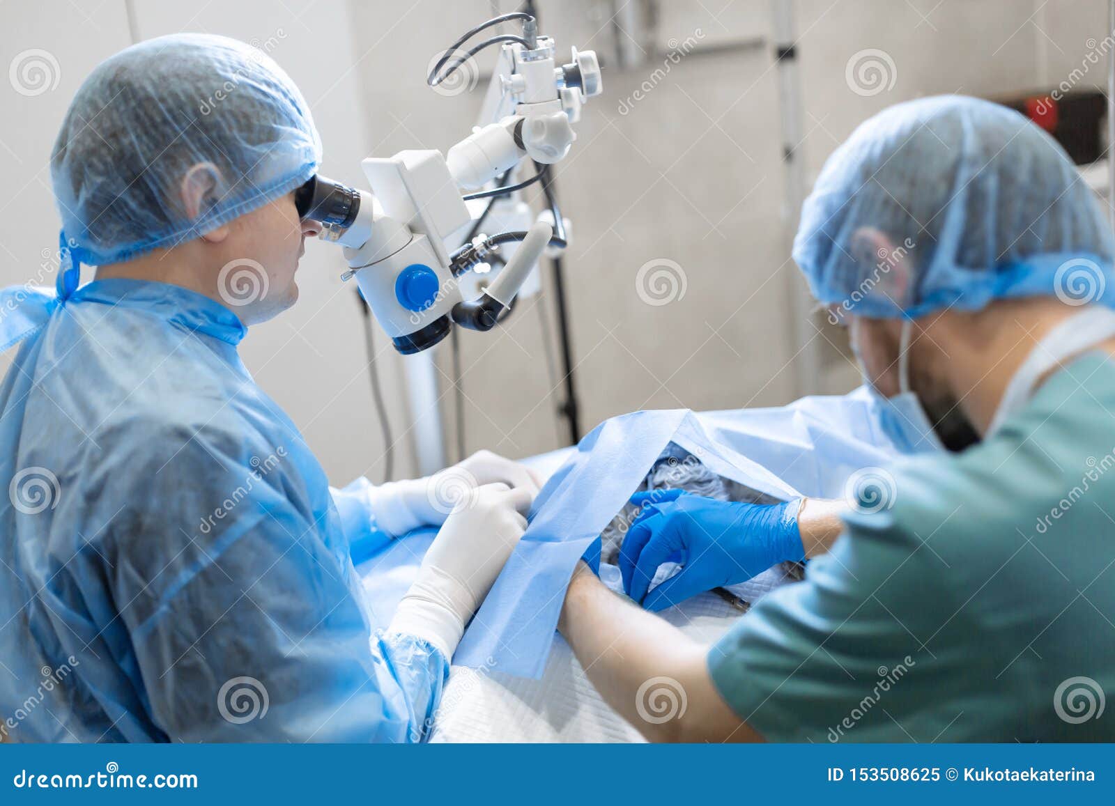 A Professional Ophthalmologist Performs Eye Surgery with a Microscope