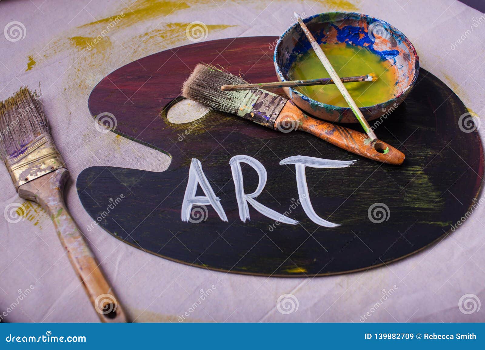 Word ART Painted on Paint Palette Paintbrushes Scattered Stock Image