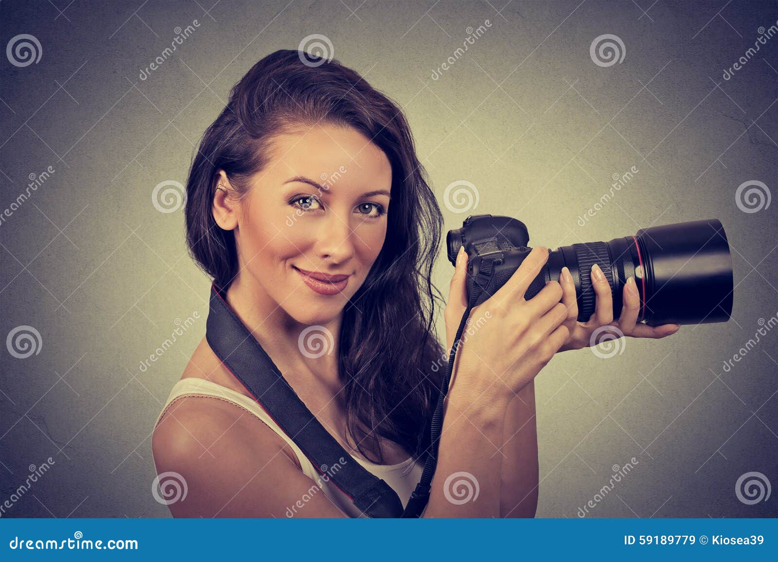 Professional Photographer Holding Digital Camera and Smiling Stock