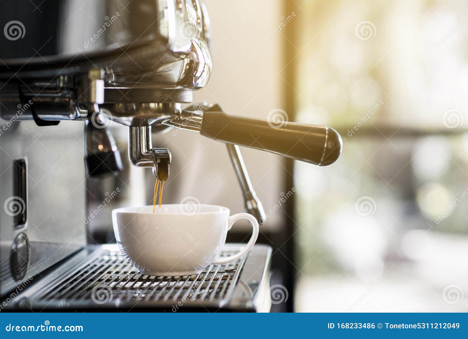 professional   photos of coffee machines that are filling coffee into a cup