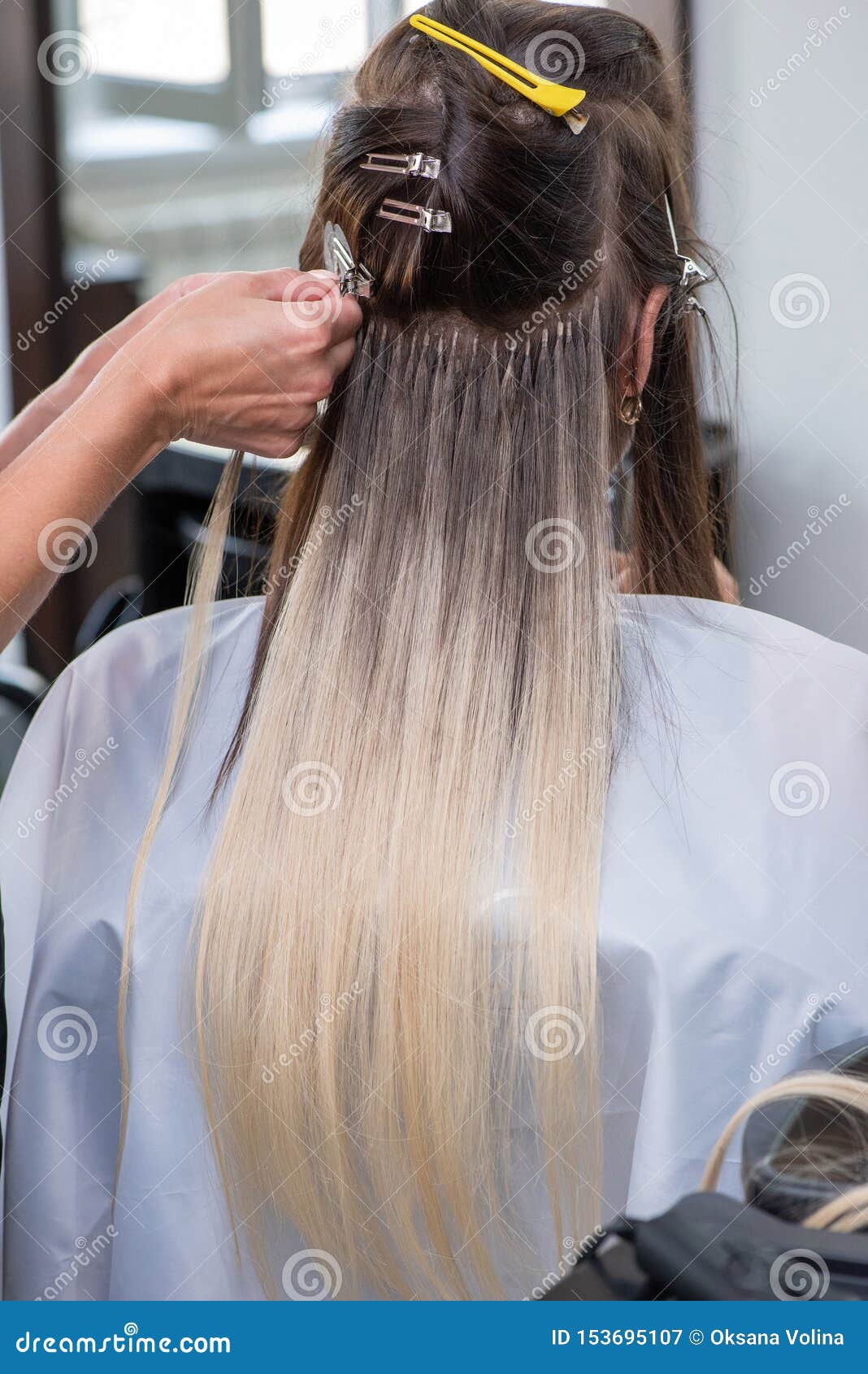 Premium Photo  Hair extension process of a young woman in a beauty salon  closeup vertical photography