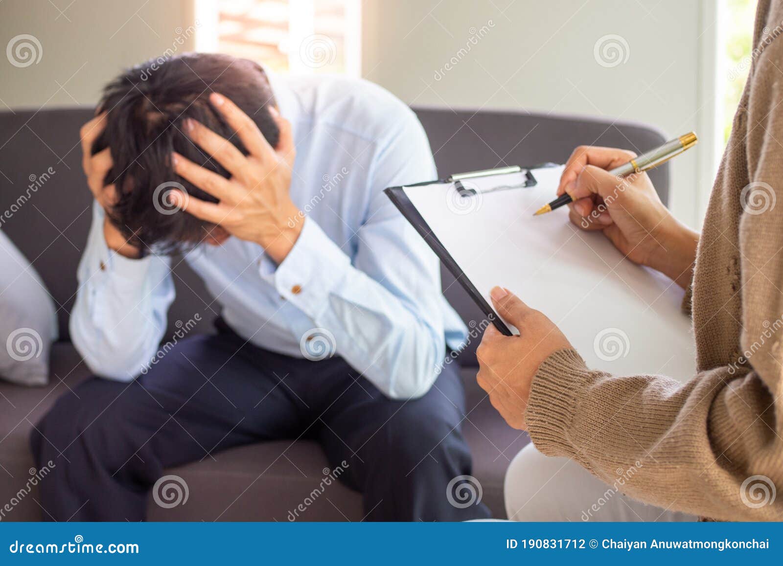 a professional psychiatrist holds a clipboard to note the details of the treatment for mental illness. depression and