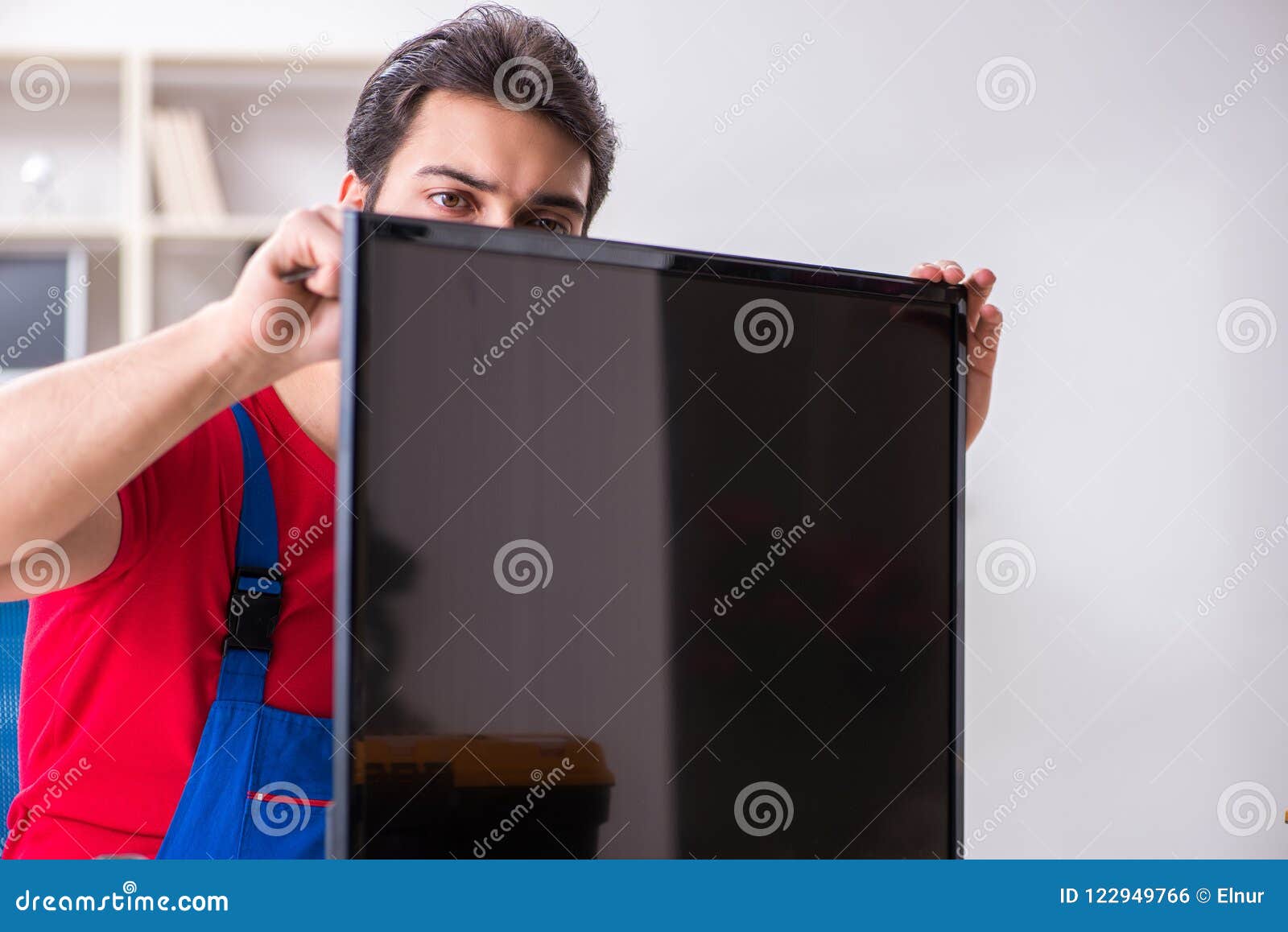 The Professional Repair Engineer Repairing Broken Tv Stock Photo