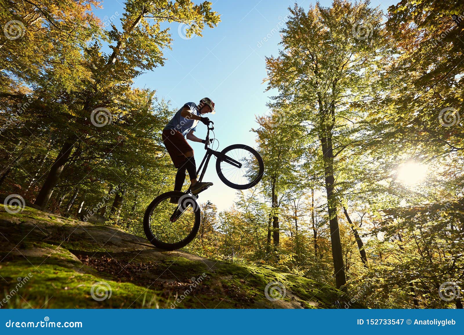 Sportsman Cyclist Balancing on Back Wheel on Trial Bicycle Stock Image ...