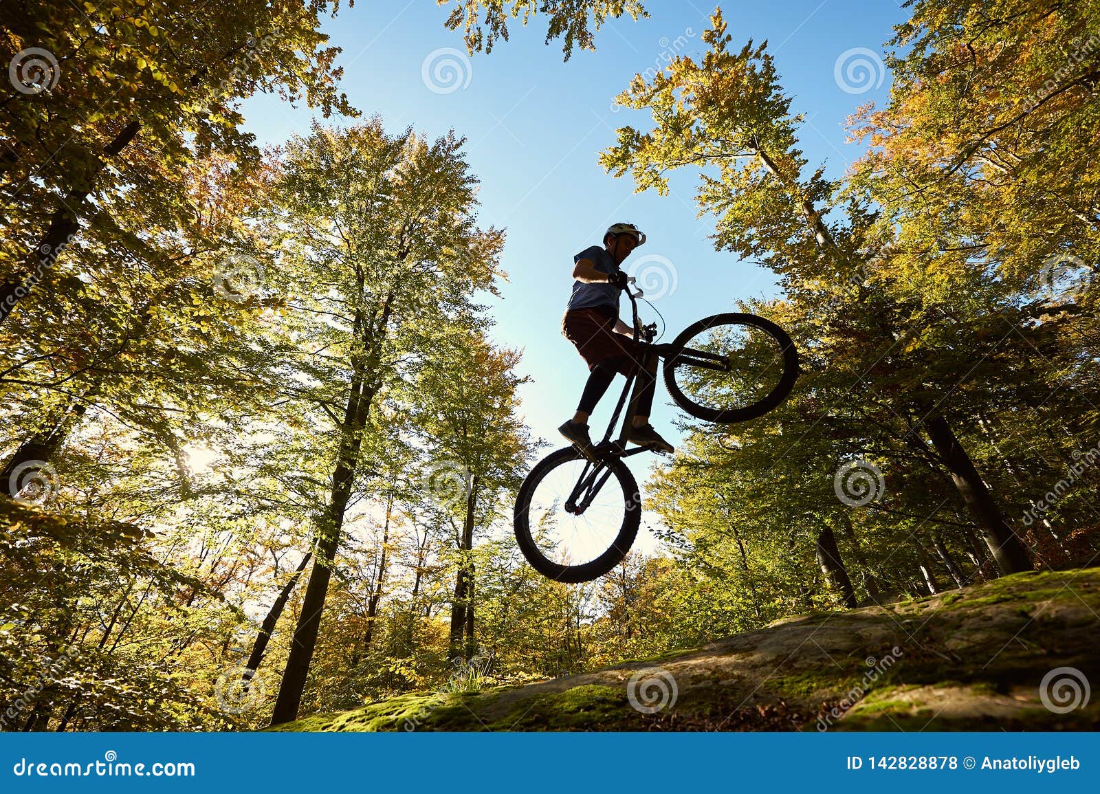 Professional Sportsman Cyclist Jump on Trial Bike on Boulder Stock ...