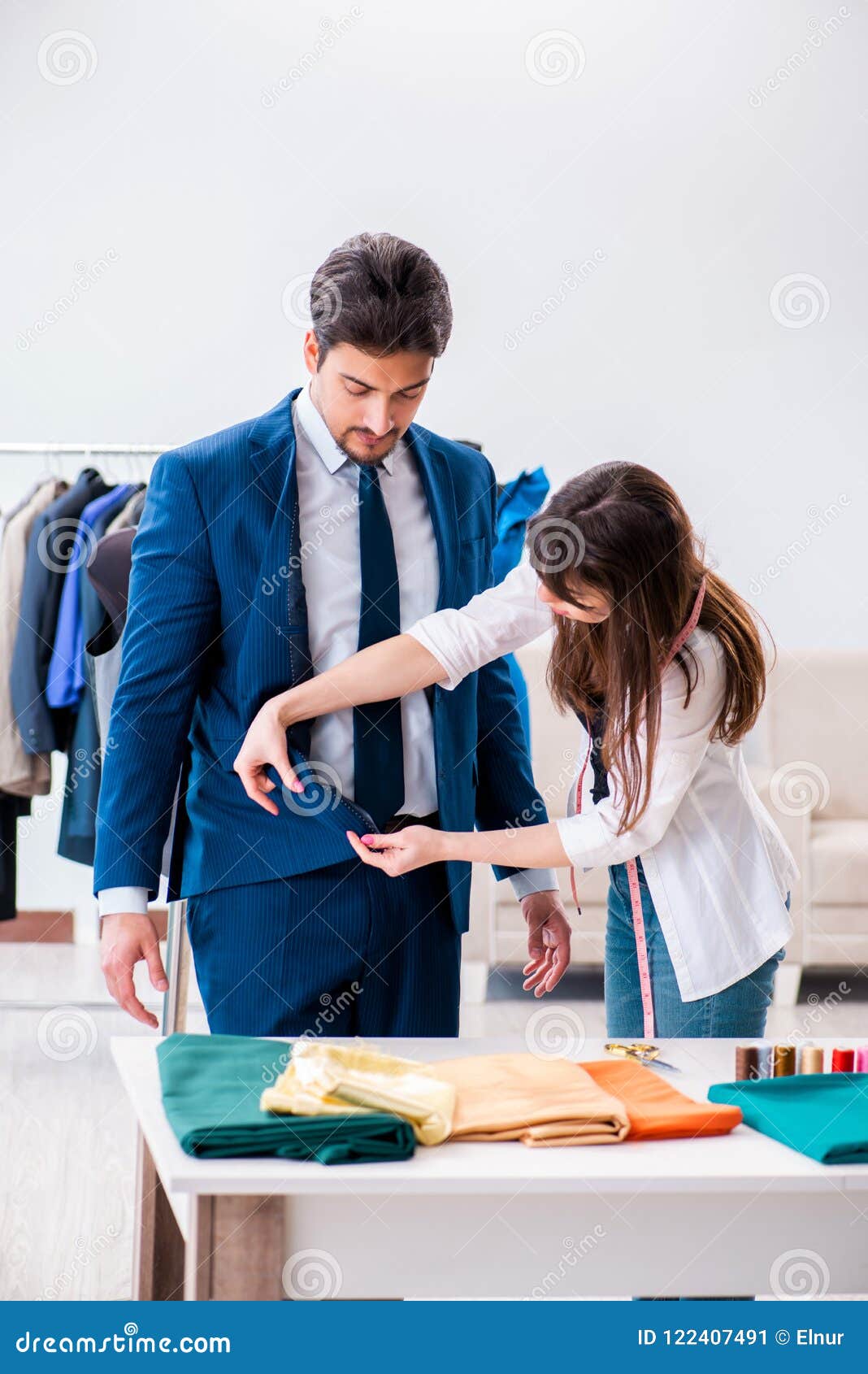 The Professional Tailor Taking Measurements for Formal Suit Stock Image ...