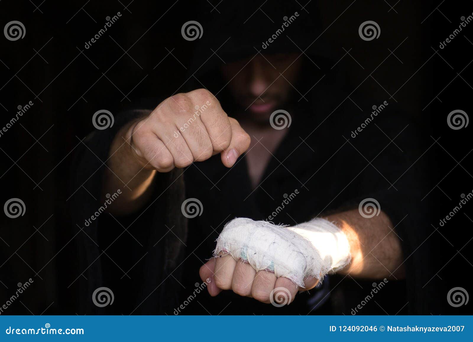 Close-up of Hands of Boxer with Bandage Ready for a Fight Against