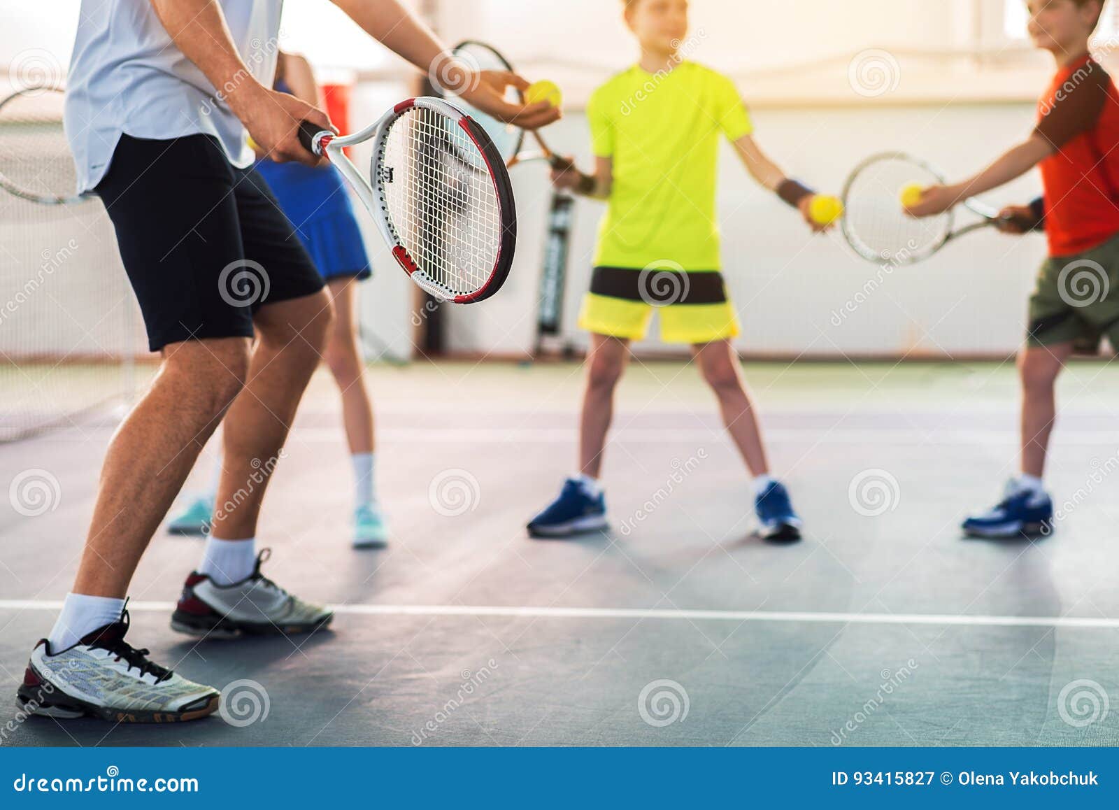 Professional Tennis Player Teaching Kids Stock Image