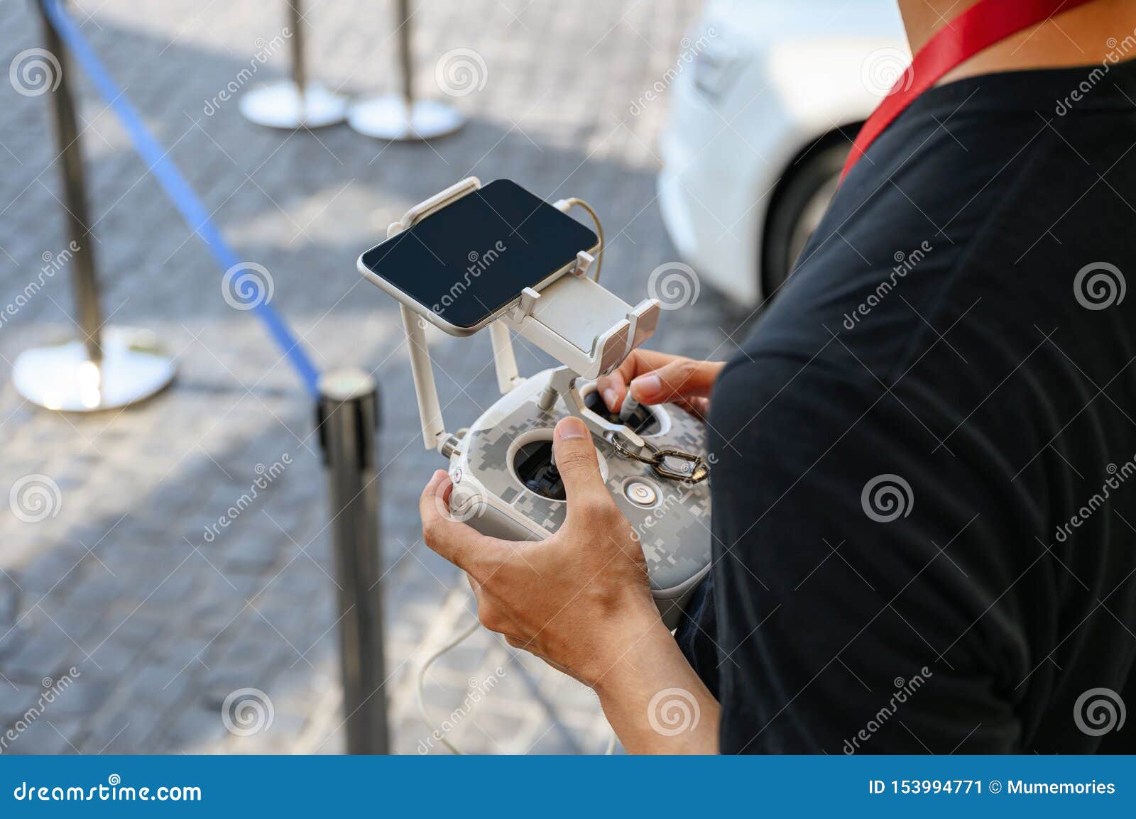 Professional Videographer Holding Remote Control for Drone Stock Image
